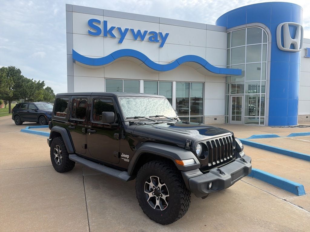 2018 Jeep Wrangler Unlimited Sport S in Black Clearcoat — front three-quarter view