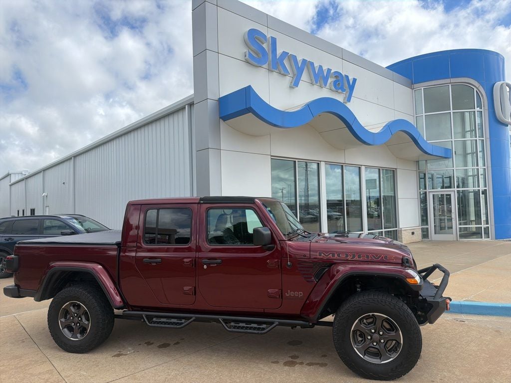 2021 Jeep Gladiator Mojave in Snazzberry Pearlcoat — front three-quarter view